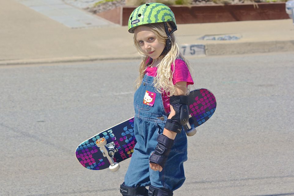 Cadence holding her skateboard